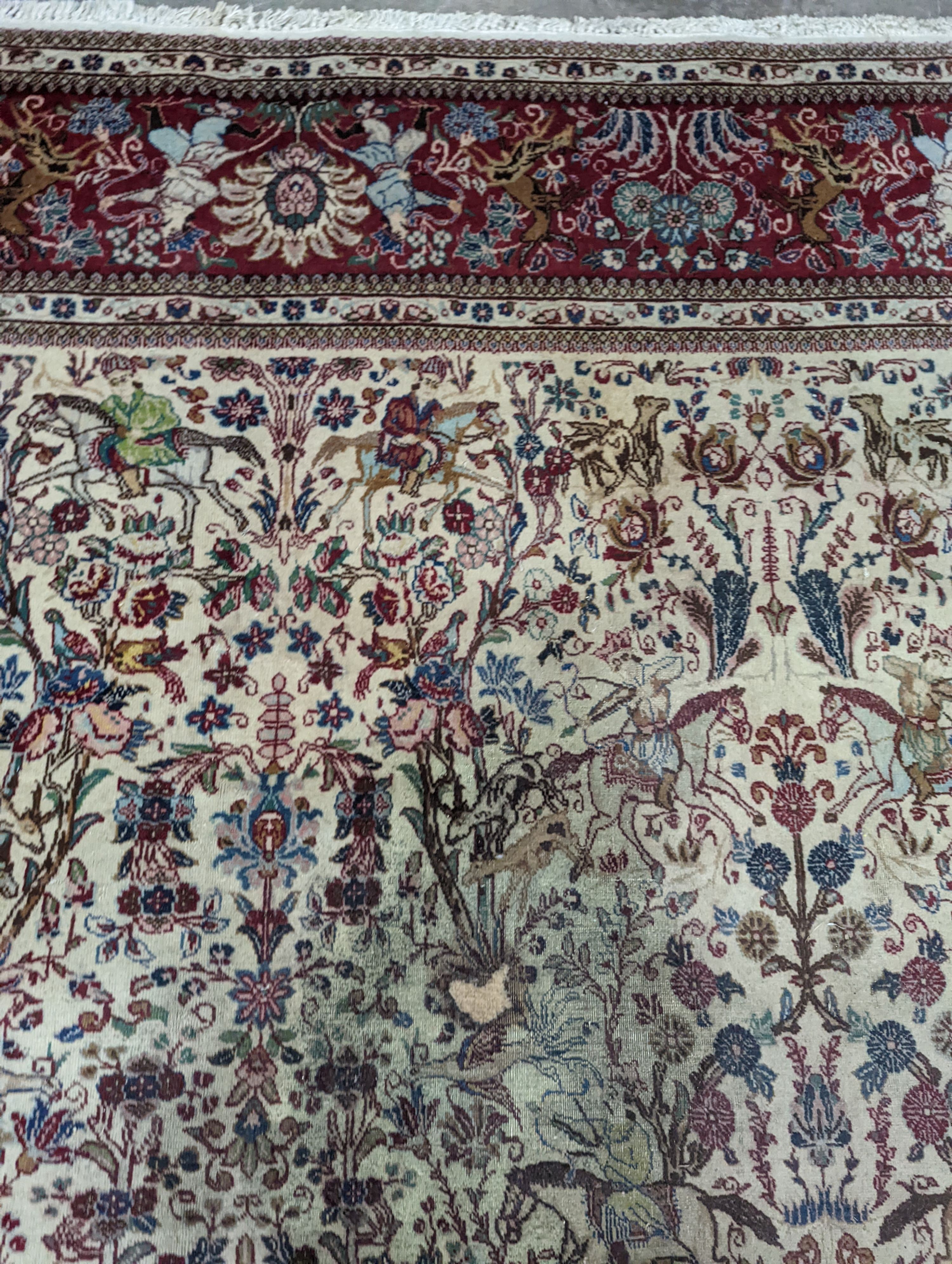 A Tabriz ivory ground pictorial rug (signed), 390 x 294cm